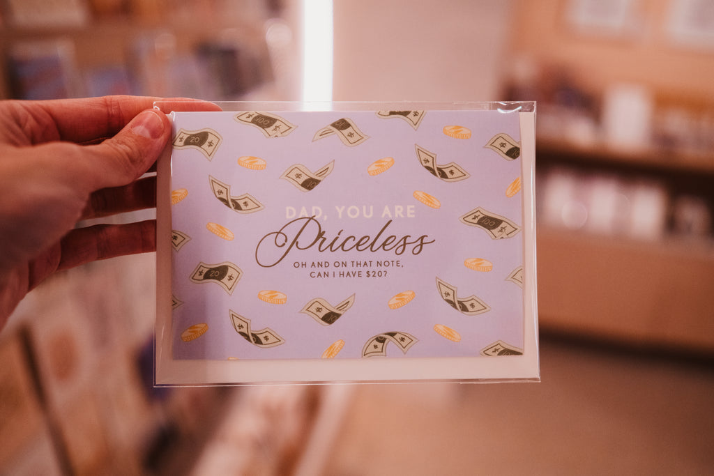 A punny Father's day card that says 'Dad you are priceless. Oh and on that note, can I have $20?' on the outside, and blank on the inside.